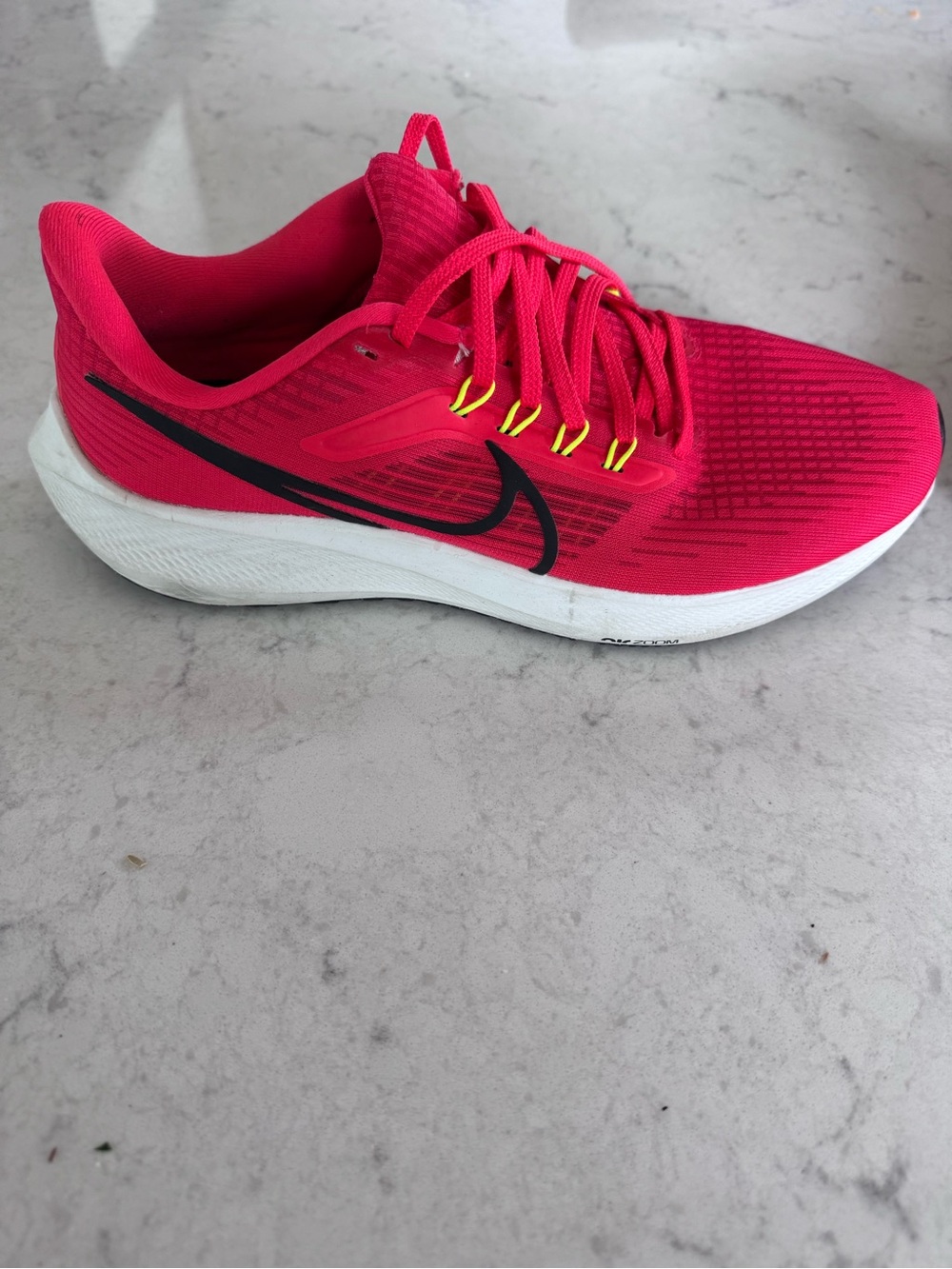 Nike Men’s Pink Running Shoe with Black Swoosh